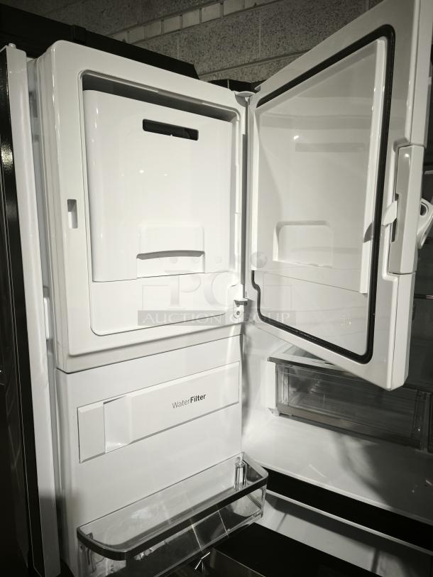 GE Profile™ 27.9 Cu. Ft. Smart 4-Door French-Door Refrigerator, model PVD28BYNFS, fingerprint-resistant, showing interior water filter compartment.