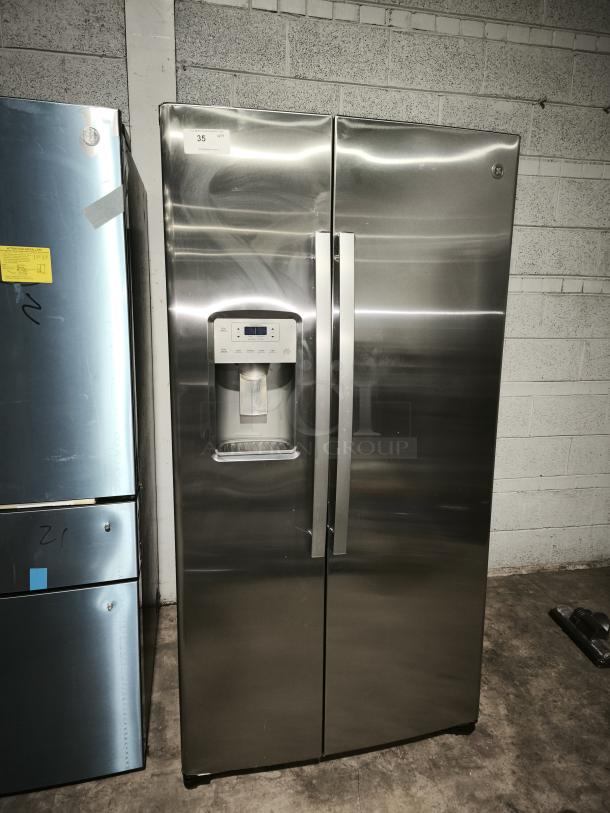 GE 21.8 cu ft side-by-side fingerprint-resistant refrigerator, model GZS22IYNFS, with ice and water dispenser.