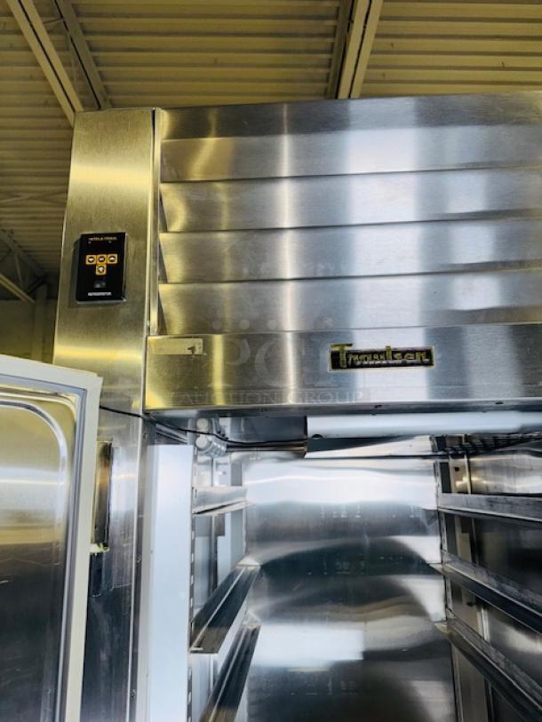 Traulsen RHT132WUT-FHS stainless steel refrigerator, like new, 24.2 Cu. Ft., digital controls, open view of shelving inside.