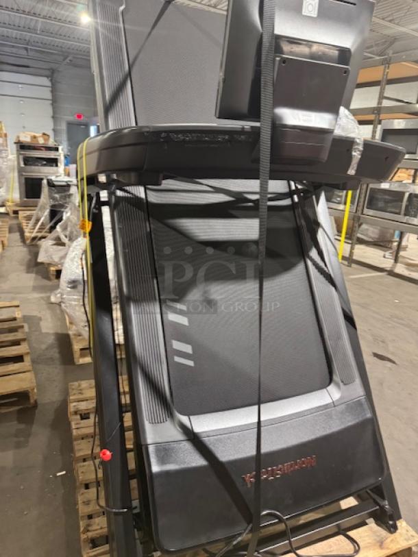 NordicTrack Commercial 1250 Treadmill, new, features 10" tilting touchscreen, sleek black design, in packaging.
