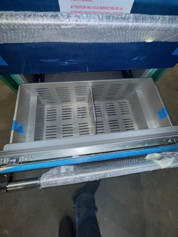 Thermador Freedom T36BT120NS stainless steel bottom freezer, brand new, showcases a spacious, organized interior with protective packaging.