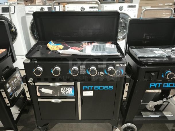 Brand new Pit Boss PB5BGD2 Ultimate 5-Burner Griddle with back-lit knobs and paper towel dispenser.