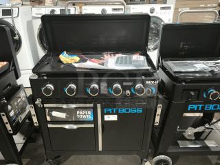 Brand new Pit Boss PB5BGD2 Ultimate 5-Burner Griddle with back-lit knobs and paper towel dispenser.