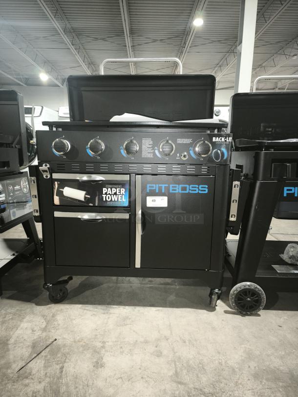 Brand new Pit Boss PB5BGD2 Ultimate 5-Burner Griddle with backlit controls and paper towel holder. Perfect condition.