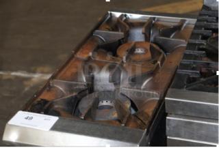 Avantco NAM-2210 stainless steel commercial 2 burner range, natural gas, 50,000 BTU, good condition. Auction tag visible.