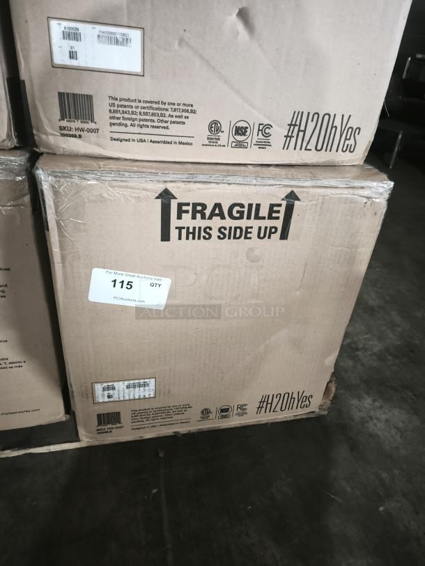 Heatworks Model 3 electric tankless water heater in original packaging, Model HW‑0007, labeled "Fragile" and "#H2OhYes."
