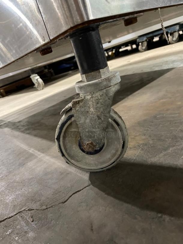 Caster wheel of the Blodgett MARK-V-III commercial convection oven, showcasing mobility on a concrete floor.