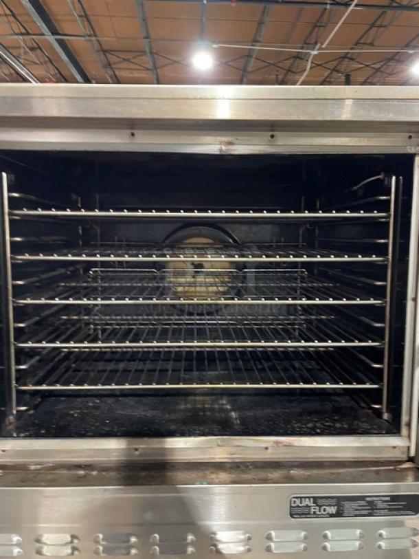 Blodgett Dual-Flow stainless steel double convection oven, natural gas, solid state thermostat, wired racks, on casters.