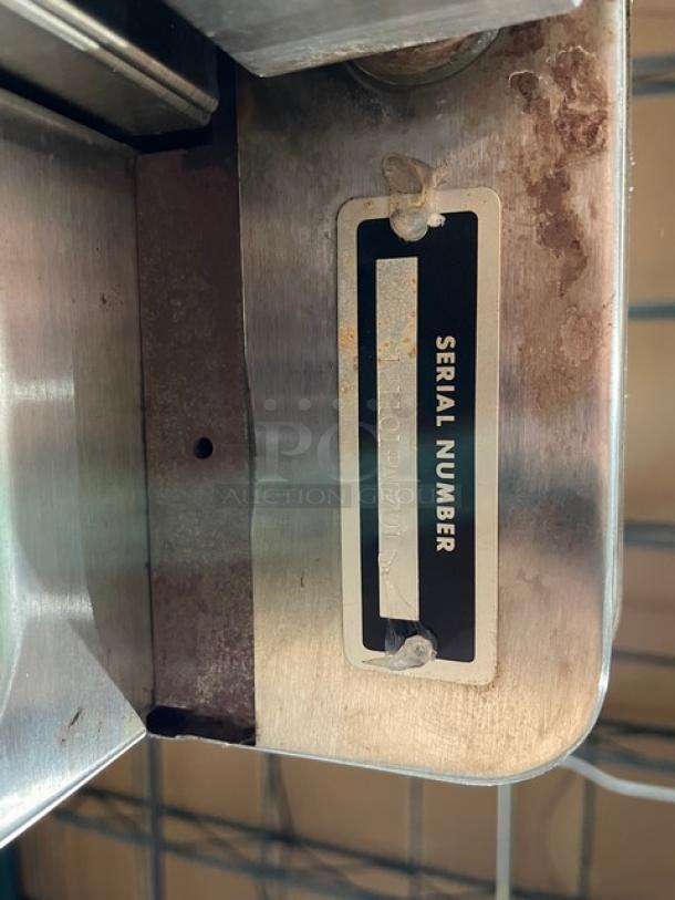 Blodgett Dual-Flow Series convection oven serial number tag, indicating model details. Stainless steel construction.