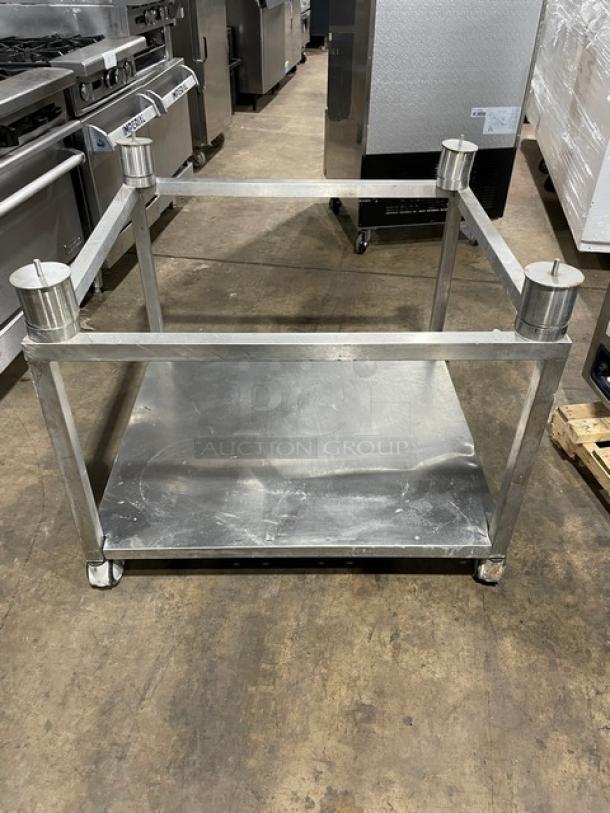 Stainless steel undershelf equipment stand for Alto-Shaam CTP7-20E combi oven, featuring sturdy metal construction and caster wheels.