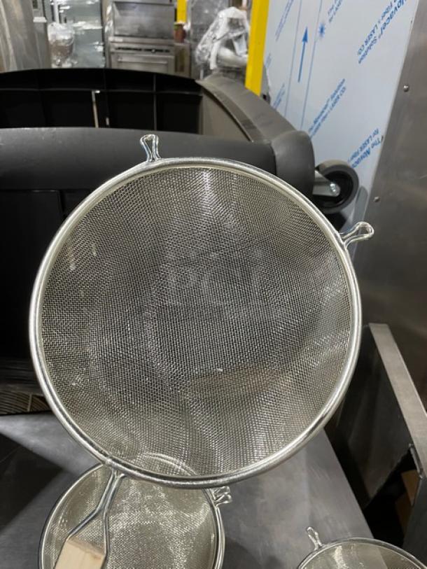 Adcraft 8" round mesh strainer, model SGTN8, tinned steel, wooden grip handle, new condition.
