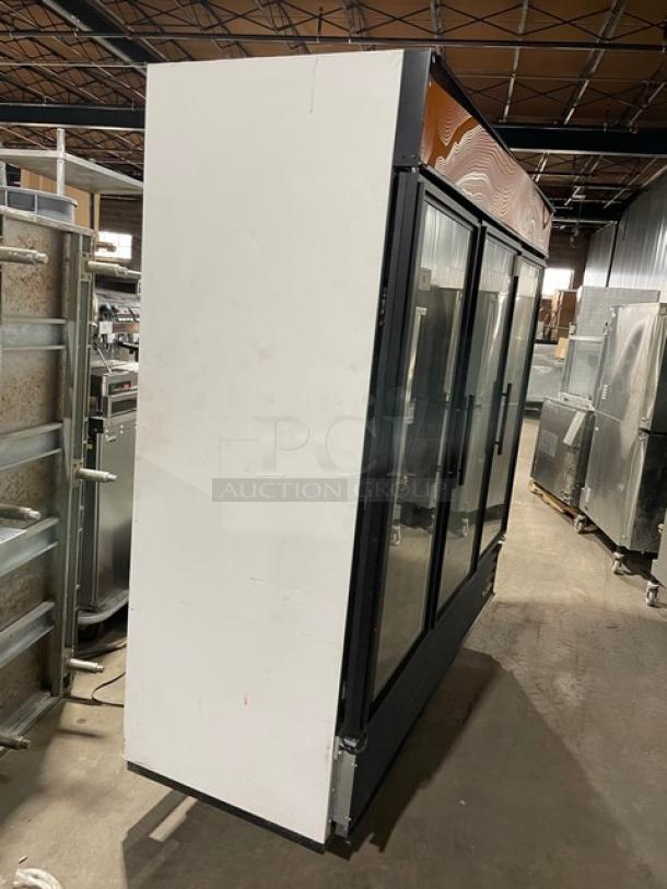 True GDM-72F black triple glass swing door merchandiser freezer with poly coated wire rack. Model SN: 7375694. 115/208-230V 1 Phase.