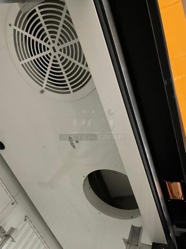 True GDM-72F commercial freezer, triple glass doors, poly-coated wired rack, black finish, model SN: 7375694, 115/208-230V.