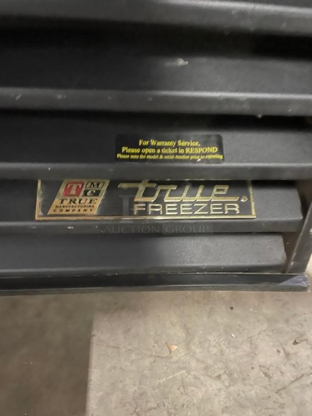 True Commercial Freezer, Model GDM-72F, black with triple glass doors, features poly coated wire racks, 115/208-230V, 1 Phase.