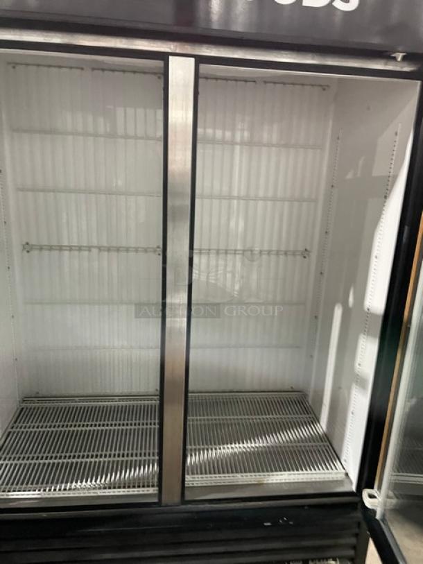 True Commercial Double Glass Door Freezer, Model GDM-49F, black exterior, poly-coated racks, on casters, 115/208-230V.