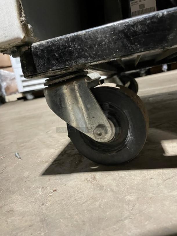 True GDM-49F Commercial Freezer, double glass swing doors, poly coated racks, on casters, model GDM-49F, SN: 1-4780407.