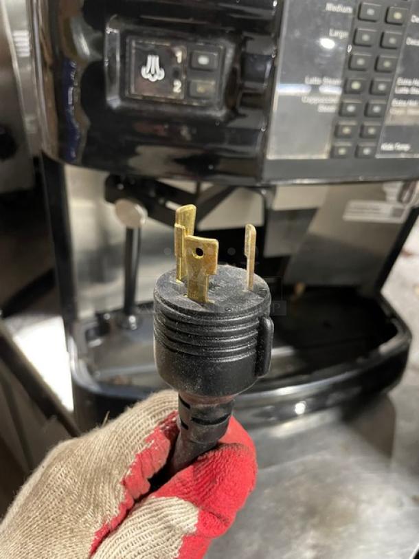 Schaerer Coffee Art Plus automatic espresso machine, black/stainless, model SCA1, with 2 hoppers, plug shown.