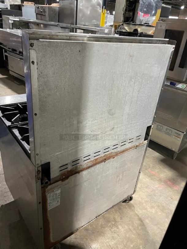 Bakers Pride 36BP6BS30N commercial gas 6-burner range/oven combo, stainless steel, with backsplash, salamander shelf, oven rack, on casters.