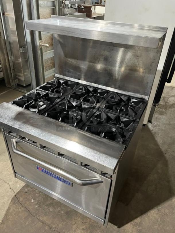 Bakers Pride stainless steel 6-burner range/oven combo with backsplash, overhead salamander shelf, and casters. Model 36BP6BS30N.