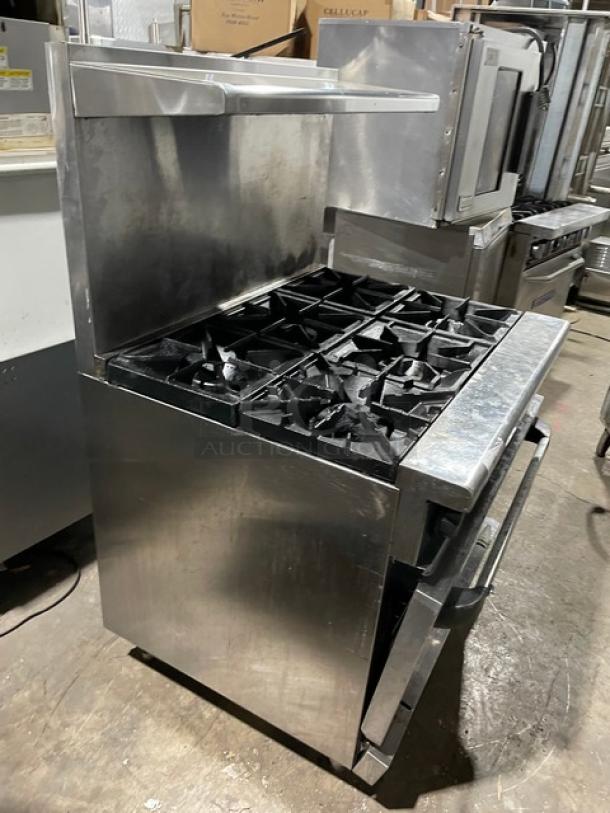 Radiance 6-burner stainless steel range/oven combo with backsplash, overhead salamander shelf, and wired oven rack. Natural gas powered.