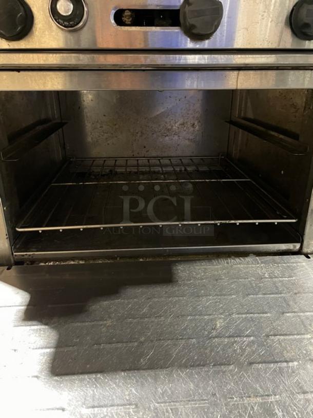 Radiance Turbo Air commercial stainless steel 6-burner range/oven combo with backsplash, salamander shelf, and wired oven rack.