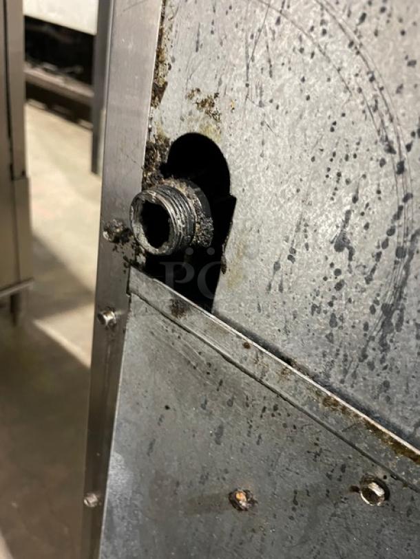 Radiance stainless steel natural gas 6-burner range/oven combo. Features backsplash, overhead salamander shelf, wired oven rack.