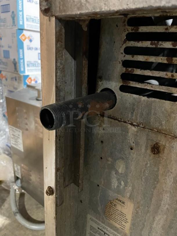 American Range commercial stainless steel 10-burner natural gas range, double oven, backsplash, salamander, on casters.