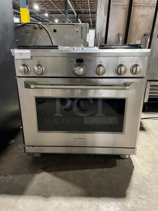 Monogram Commercial Stainless Steel Gas Powered 4 Burner Range/Oven Combo! With Wired Oven Rack! On Legs! - Item #1217651