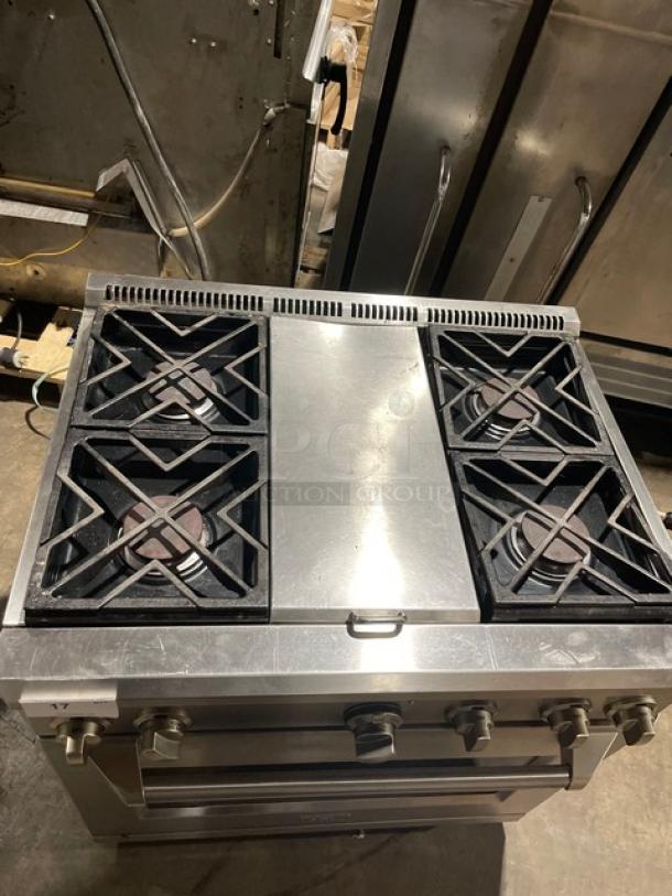 Monogram stainless steel gas range/oven combo with 4 burners, wired oven rack, and legs. Commercial-grade, used condition.