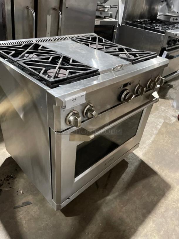 Monogram stainless steel 4-burner gas range/oven combo with wired oven rack, on legs. Excellent condition.
