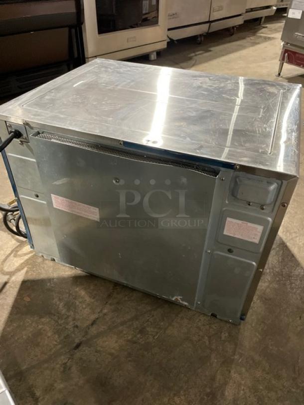 Panasonic Pro II Series NE-2180 commercial stainless steel steamer microwave oven, used, with visible labels on the back.