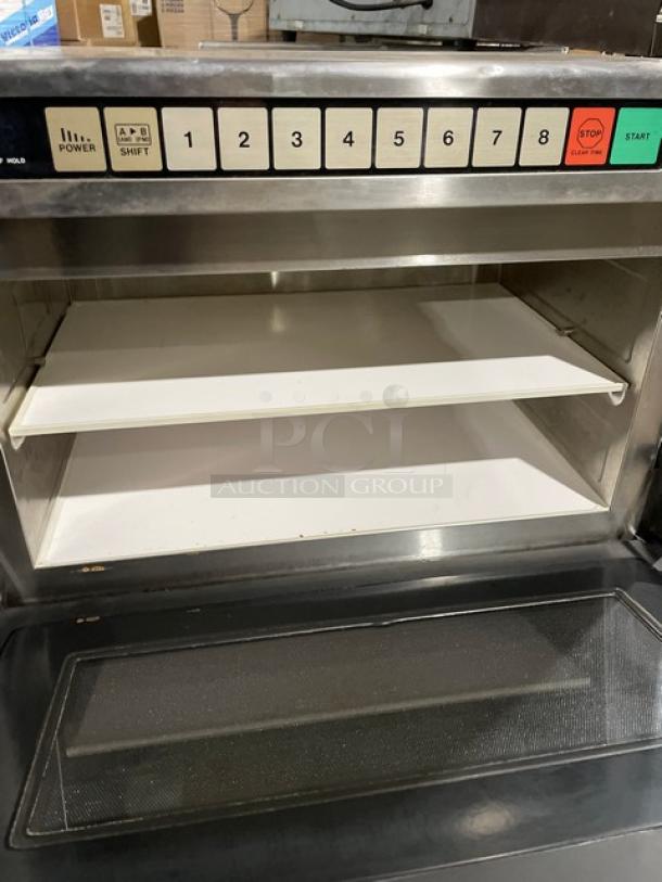 Panasonic Pro II Series commercial stainless steel microwave oven, Model NE-2180. Features numeric keypad and white interior trays.