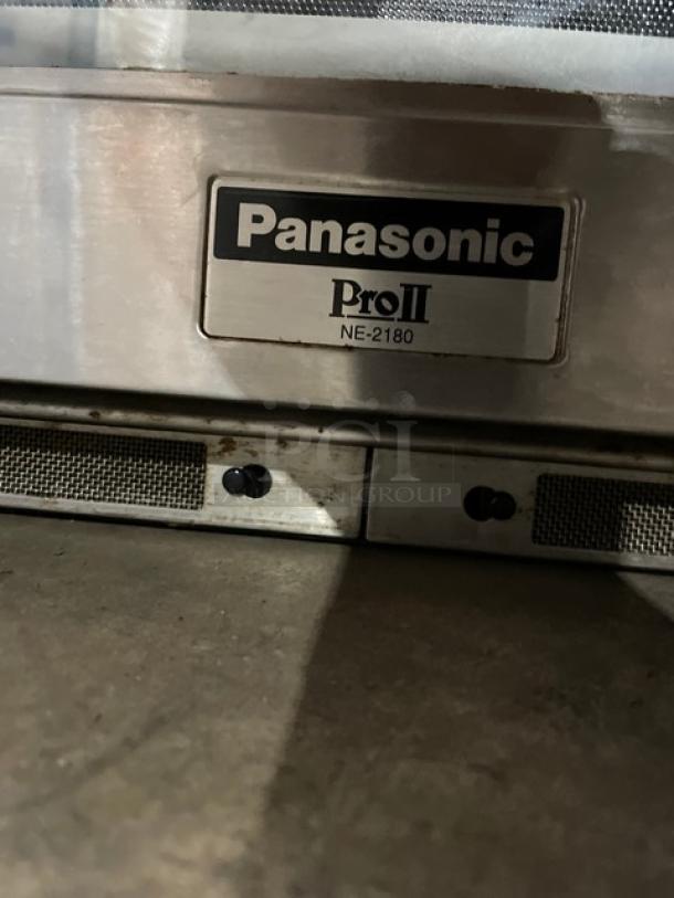 Panasonic Pro II Series NE-2180 commercial stainless steel microwave oven with sonic steamer, model tag visible.
