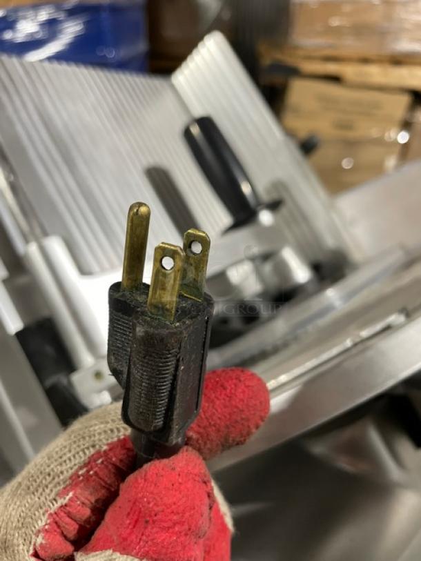 Kolossal 330IKUS electric deli meat slicer, model 330IKUS, SN 1590/08, 120V, featuring sturdy countertop design and metal legs.