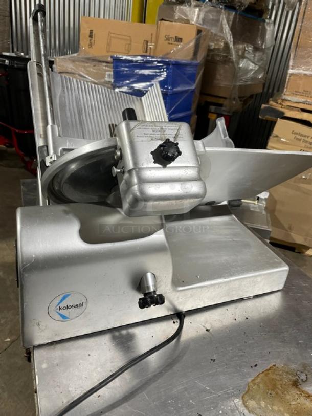 Kolossal 330IKUS electric deli slicer, commercial countertop model, 120V, on legs. SN: 1590/08. Slight wear visible.