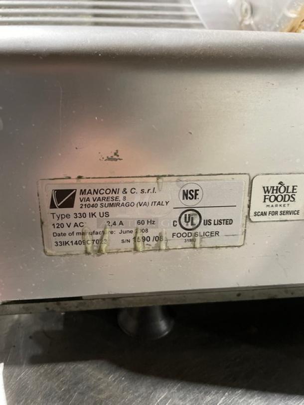 Kolossal 330IKUS electric deli meat slicer, countertop model on legs. Features 120V, NSF and UL listed. Serial: 1590/08.