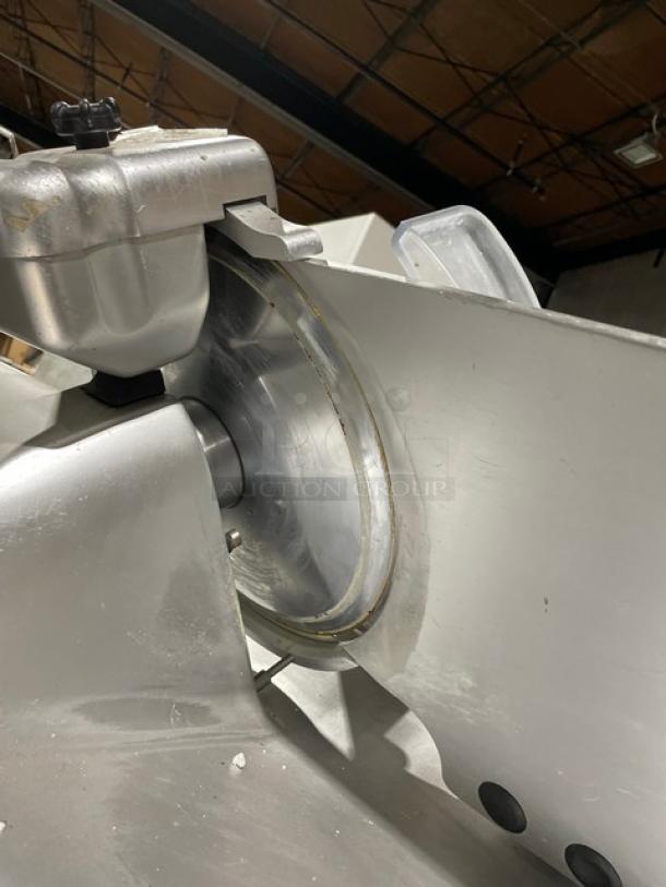 Kolossal 330IKUS electric countertop deli meat slicer, 120V, on legs, stainless steel, used, serial number 1590/08.