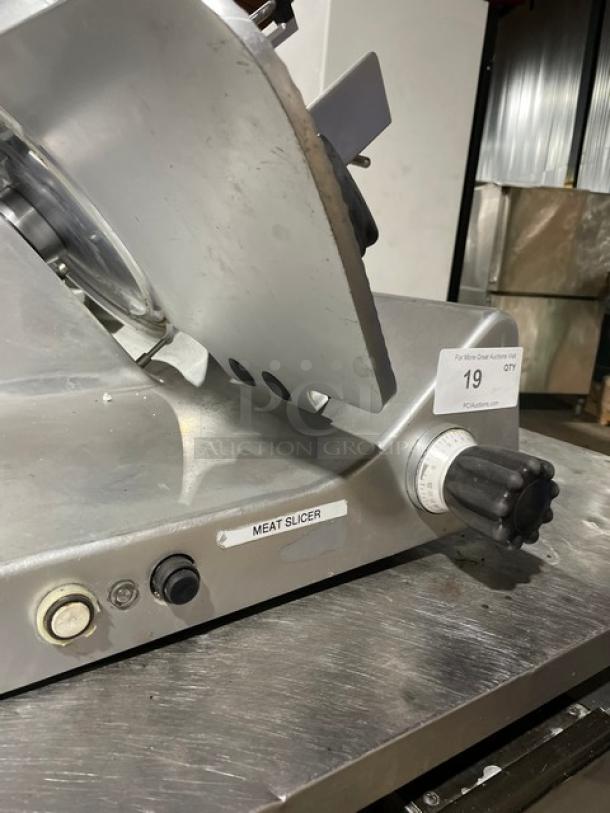 Kolossal 330IKUS electric deli meat slicer, good condition, countertop model, 120V, on legs, "Meat Slicer" label visible.