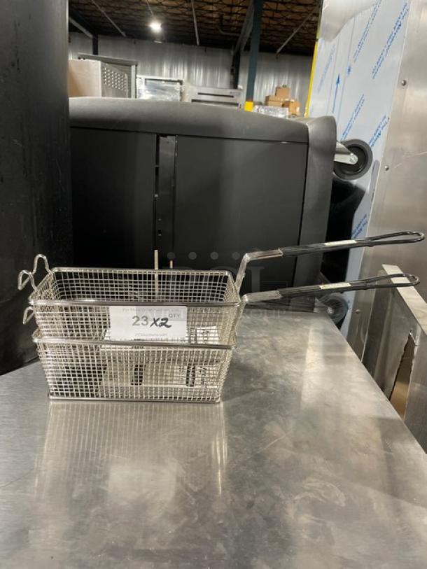 Adcraft Commercial Fry Basket FBR11571, new, wired mesh, black grip handle, label reads "23X2", stainless steel.