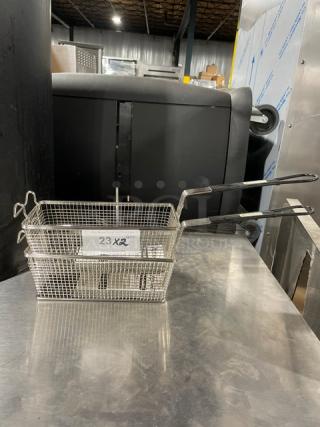 Adcraft Commercial Fry Basket FBR11571, new, wired mesh, black grip handle, label reads "23X2", stainless steel.