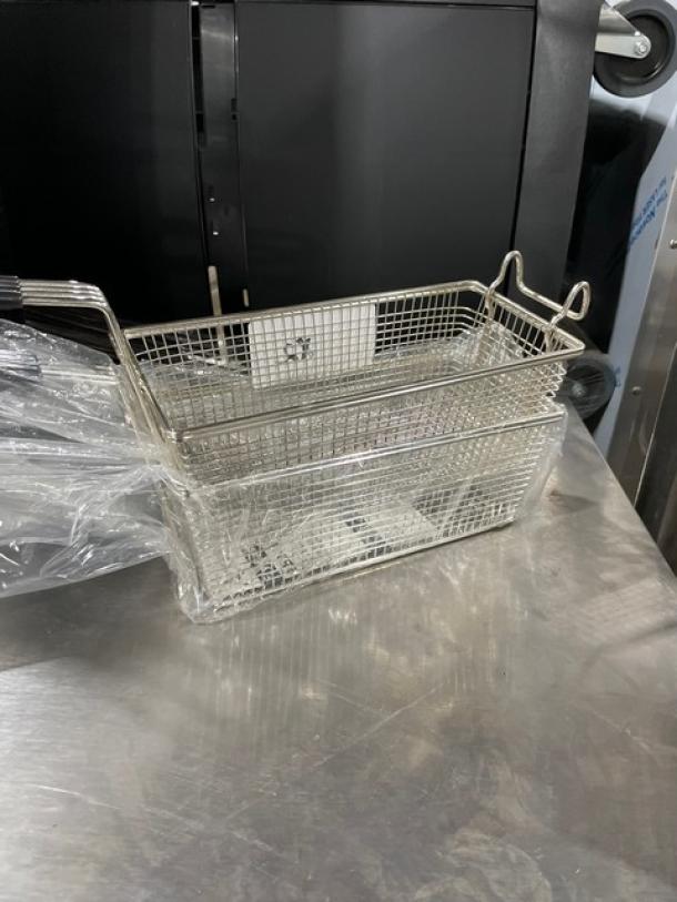 Adcraft commercial wire mesh fry basket, model FBR11571, new condition, black grip handle, wrapped in plastic.