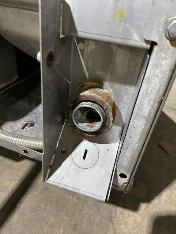 Hobart LXe Series commercial dishwasher fitting, showing detailed stainless steel construction and minor surface rust.