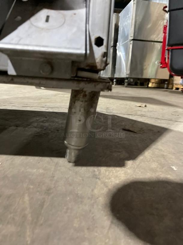 Hobart LXe series undercounter dishwasher on legs, stainless steel, Energy Star certified, minor rust visible on leg.