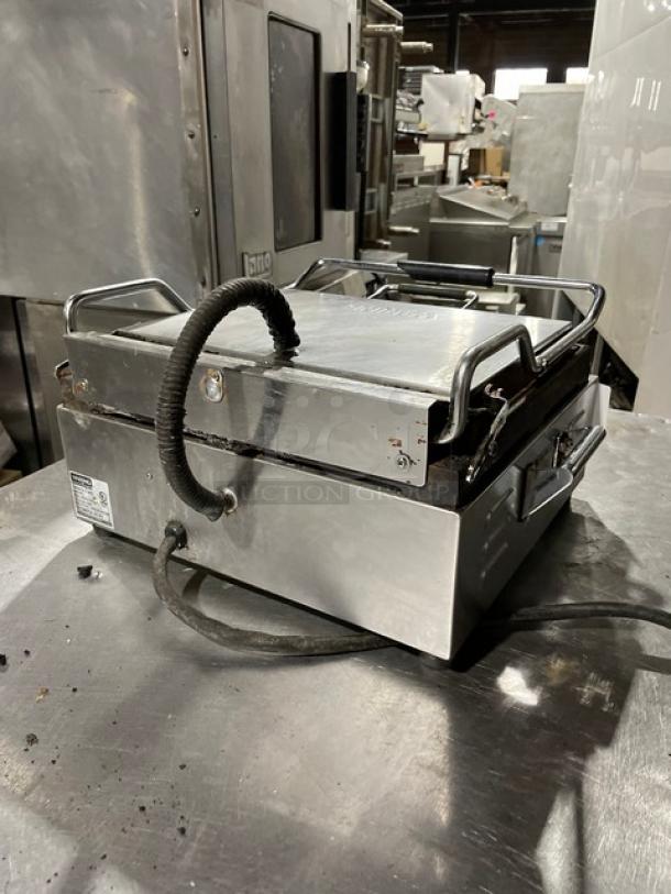 Waring Panini Supremo WPG250T grill, stainless steel, electric, with timer, top and bottom grooved grates, 120V power.