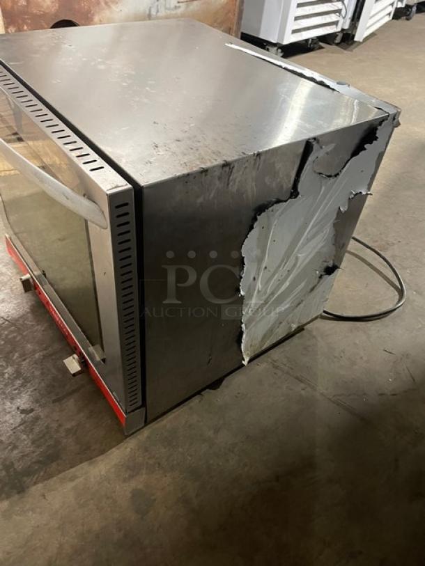 Avantco Commercial Stainless Steel Countertop Convection Oven, Model 177CO28, with wired rack. Visible exterior damage.