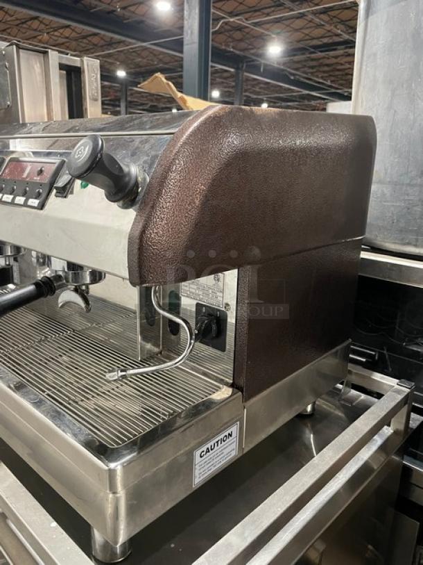 Cecilware Venezia ESP2 double espresso machine, stainless steel, with steam wand, drip tray, and caution label, on legs.