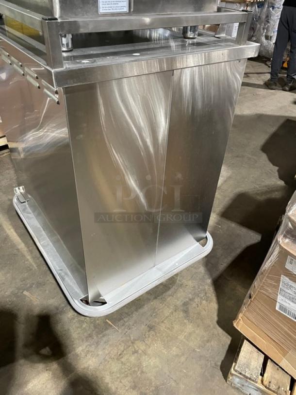 Carter-Hoffmann stainless steel meal/tray transport cart, model TE1S12, SN: 462720-052012, with built-in pan slide and casters.
