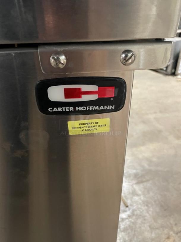 Carter-Hoffmann TE1S12 stainless steel single door transport cart, built-in pan slide, on casters, with "SUNY Health Science Center" label.