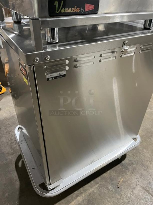 Carter-Hoffmann stainless steel single door transport cart, model TE1S12. Features built-in pan slide, on casters, good condition.