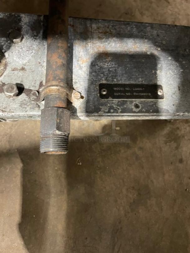 Vulcan LG400 fryer base showing model and serial number plaque, highlighting wear and natural gas connection.